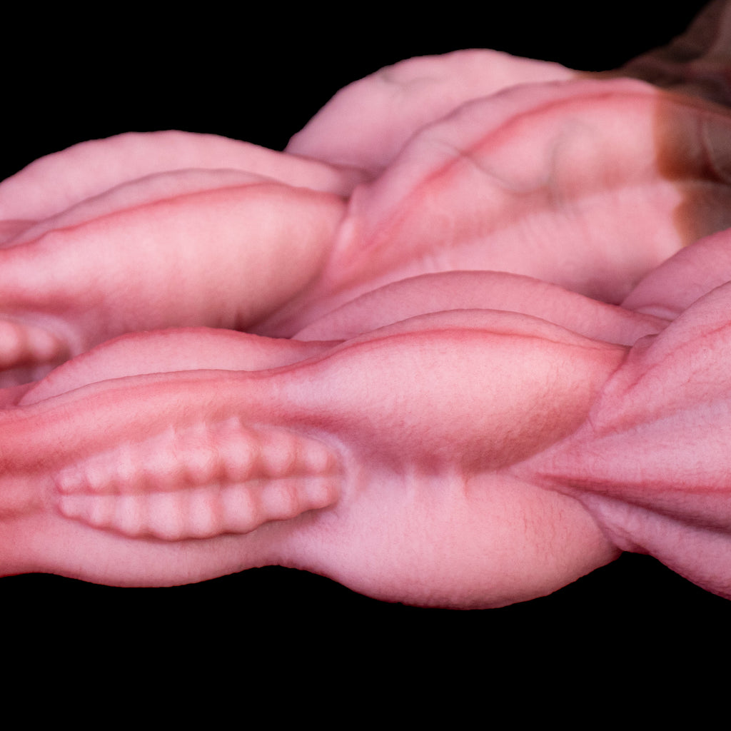 Oieffur Nagaros Feathered Serpent God platinum silicone fantasy dildo with detailed serpent design and textured surface.