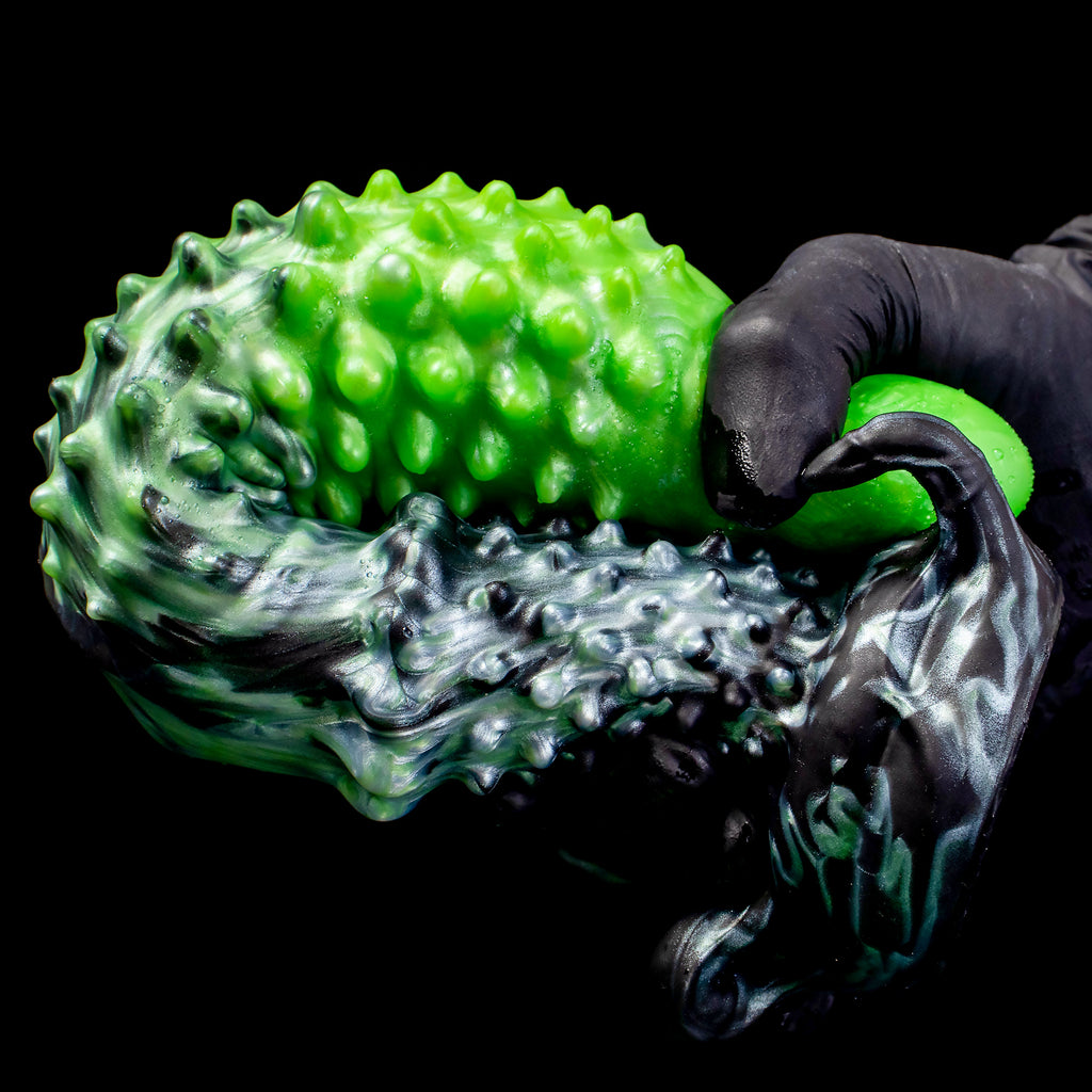 Black "Abyss" Spiked Dildo by Oieffur, a platinum silicone fantasy dildo with spiked design, shown in close-up.