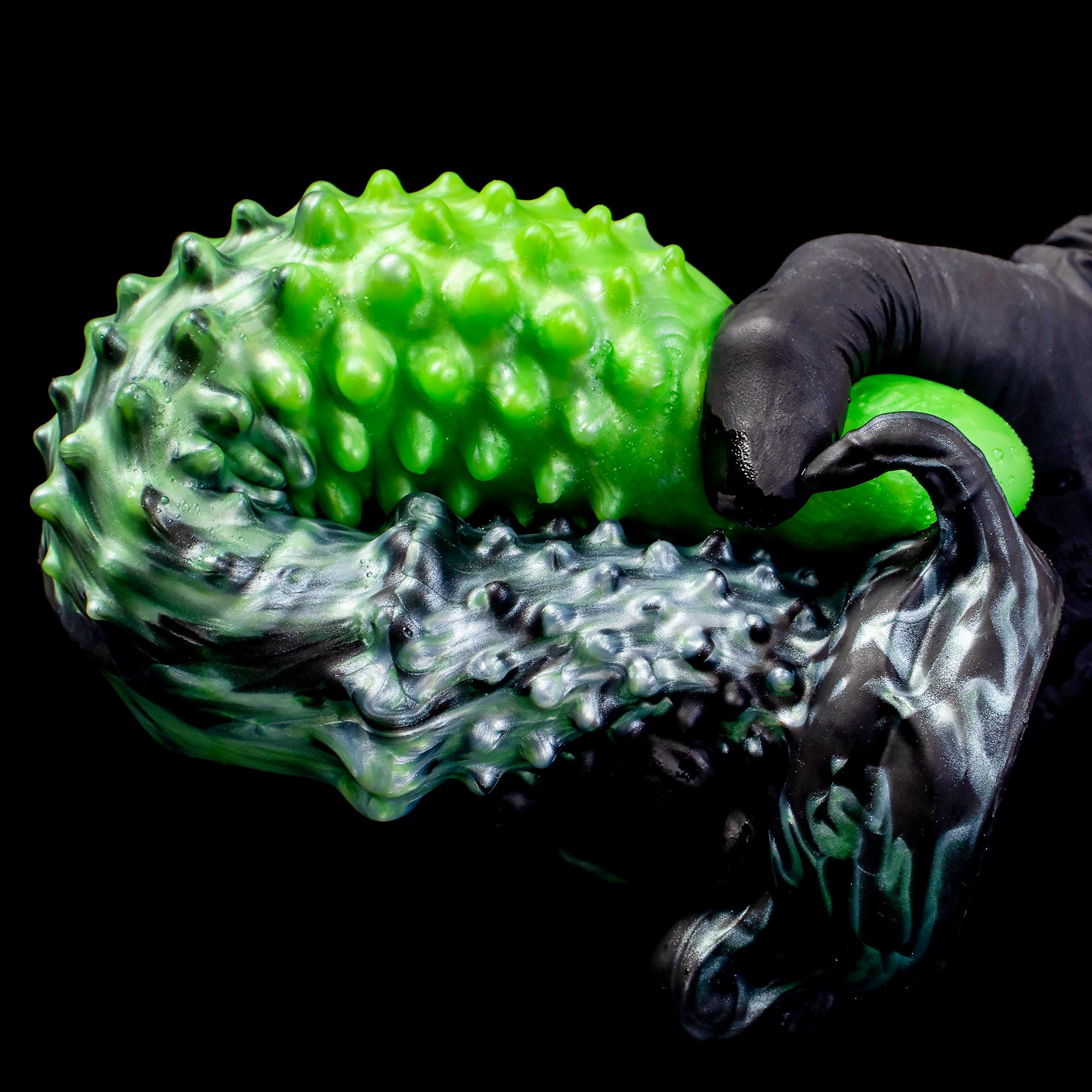 Black "Abyss" Spiked Dildo by Oieffur, a platinum silicone fantasy dildo with spiked design, shown in close-up.