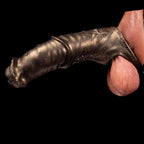 Oieffur Warhorse flexible penis sleeve extender with girth enhancement and cock ring, shown in a close-up view