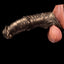 Oieffur Warhorse flexible penis sleeve extender with girth enhancement and cock ring, shown in a close-up view