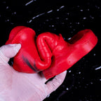 Red Oieffur male silicone penis sleeve, a girth and length extender, shown on a penis sheath for enhanced size and sensation.